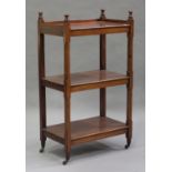 A Victorian mahogany three-tier buffet with chamfered block supports, on turned legs and castors,