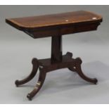 A Regency mahogany fold-over card table, the crossbanded top raised on a flared column and four