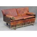 A 20th century Middle Eastern hardwood settee, the sides and back panels with carved decoration,