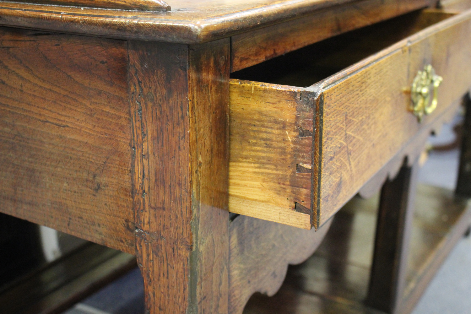 An 18th century provincial oak dresser, the shelf back with a shaped frieze fitted with wrought - Image 2 of 2