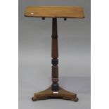 A 19th century mahogany rectangular tip-top wine table, raised on a turned column and triform