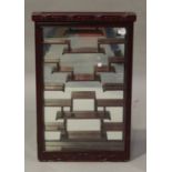 A late 20th century Chinese hardwood hanging display cabinet with asymmetric shelves, height 81cm,