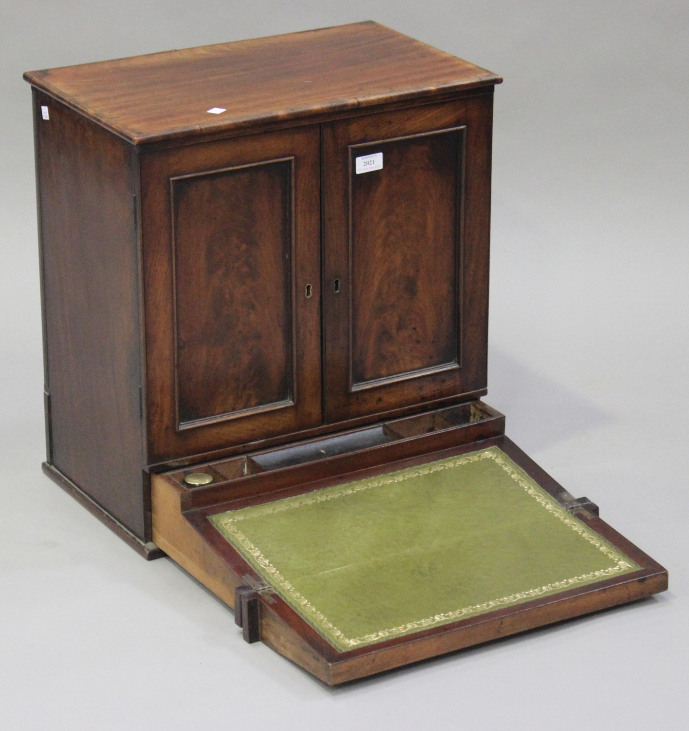 A Victorian mahogany writing cabinet, fitted with a pair of panel doors above a pull-out writing - Image 2 of 2