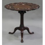 A George III and later mahogany tip-top supper table, the shaped circular top with nine dished