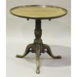 A 19th century and later mahogany tip-top circular wine table, the dished top raised on a turned and