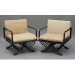 A pair of 20th century hardwood framed armchairs with upholstered seats and backs, on outswept legs,