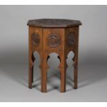 An Anglo-Indian Arts and Crafts style hardwood octagonal workbox occasional table, the hinged top