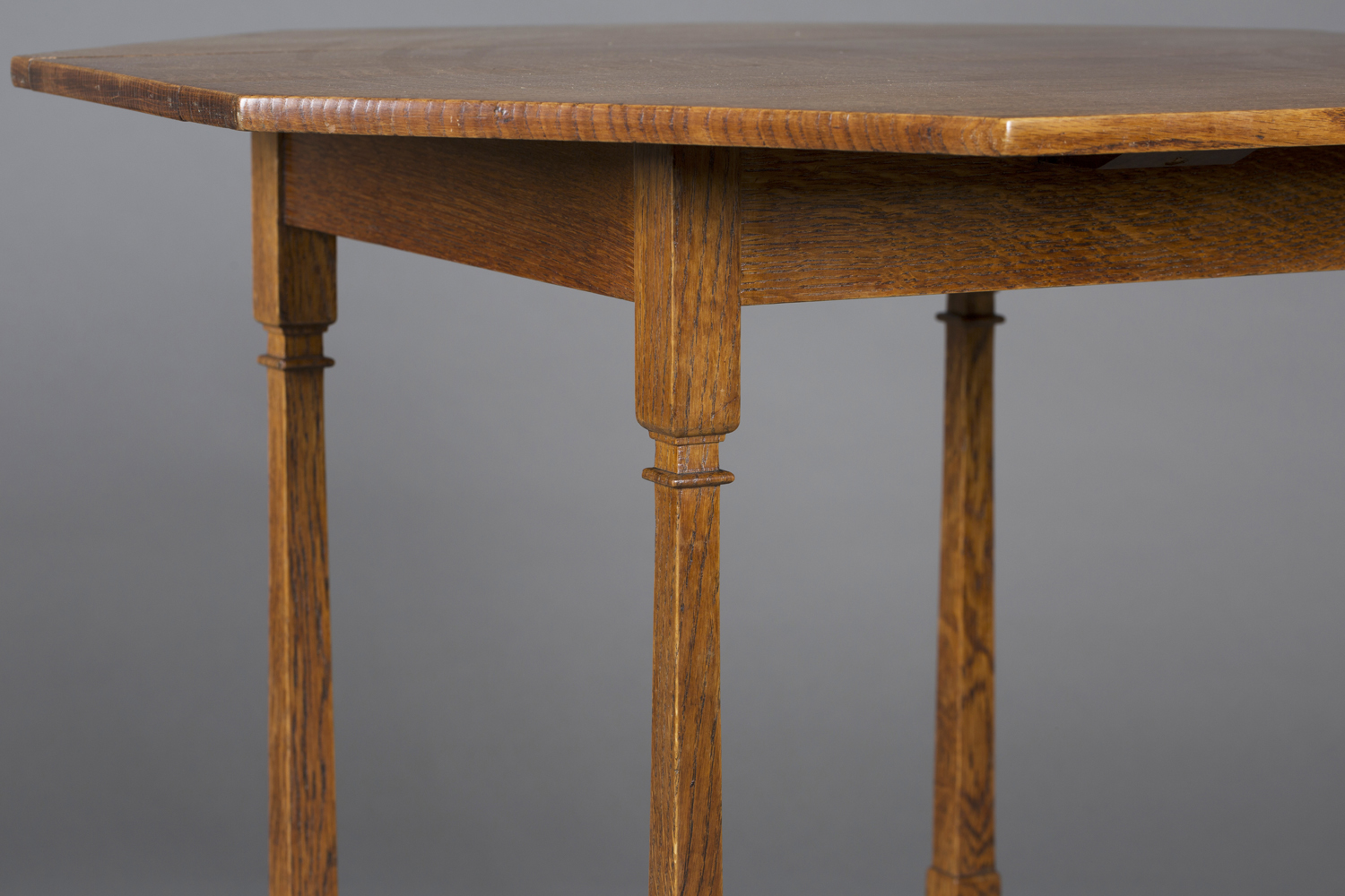 An Edwardian Arts and Crafts oak octagonal occasional table by Shapland & Petter, raised on square - Image 3 of 4