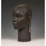 A stoneware studio pottery model of a female African tribal head, larger than life size with well-