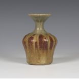 An Eric James Mellon studio pottery vase, dated 1969, the baluster body with waisted flared neck,