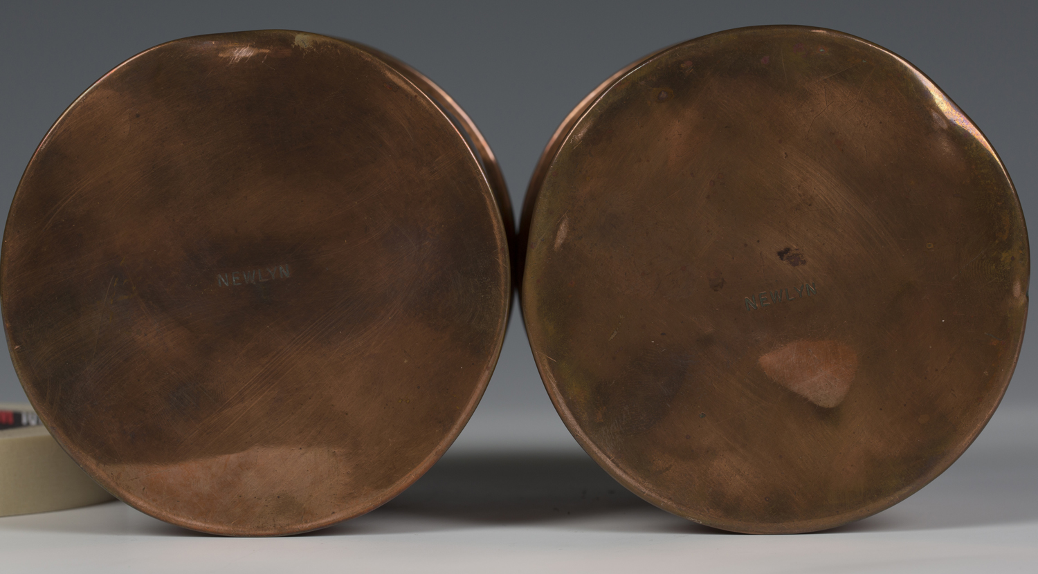 Two Arts and Crafts Newlyn copper jars and covers of cylindrical form, one decorated with overall - Image 2 of 2