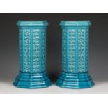 A pair of Burmantofts pottery turquoise glazed jardinière stands, late 19th century, of octagonal