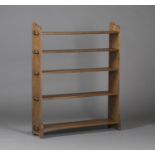 An early 20th century Arts and Crafts style oak five-tier open bookcase, in the manner of