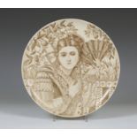 A Staffordshire earthenware circular dish, dated 1880, painted in brown with a head and shoulders