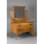 An Edwardian Arts and Crafts oak dressing chest, in the manner of Liberty & Co, fitted with a