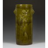 A Bretby pottery olive green glazed stick stand, 1880s, of cylindrical shape, relief decorated