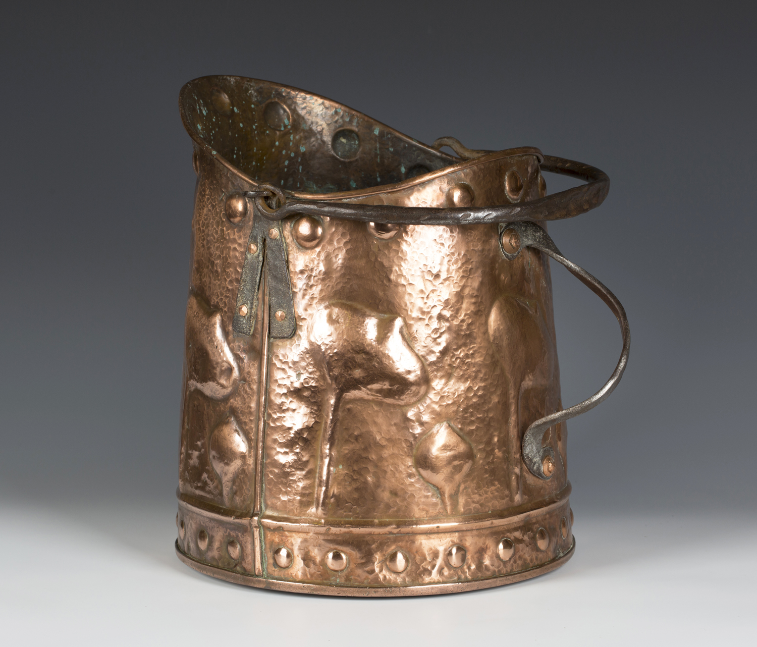 An Arts and Crafts polished copper coal bucket with applied wrought iron handles, the hammered - Image 3 of 3