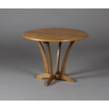 An early 20th century Arts and Crafts style oak circular occasional table, the circular top raised