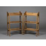 A pair of early 20th century Arts and Crafts oak three-tier open bookcases, attributed to Wylie &