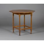 An Edwardian Arts and Crafts oak octagonal occasional table by Shapland & Petter, raised on square