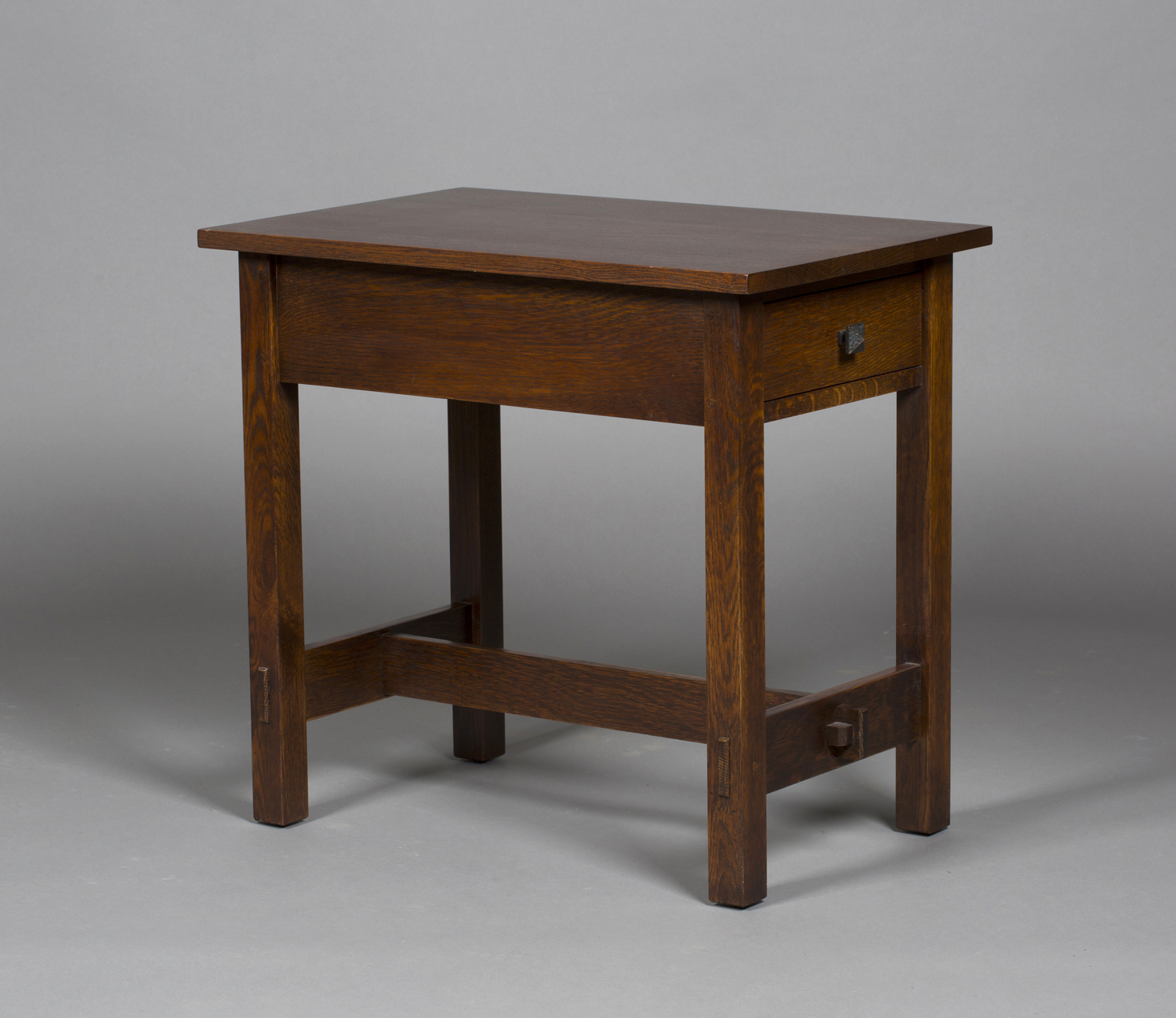 A modern American Arts and Crafts style stained oak side table, after a design by Gustav Stickley,