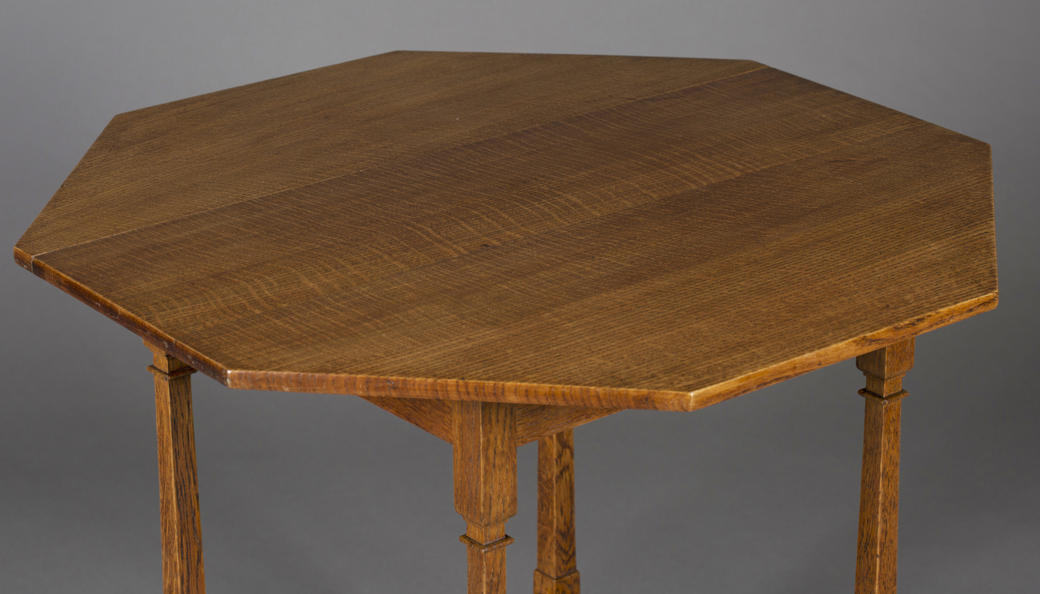 An Edwardian Arts and Crafts oak octagonal occasional table by Shapland & Petter, raised on square - Image 4 of 4