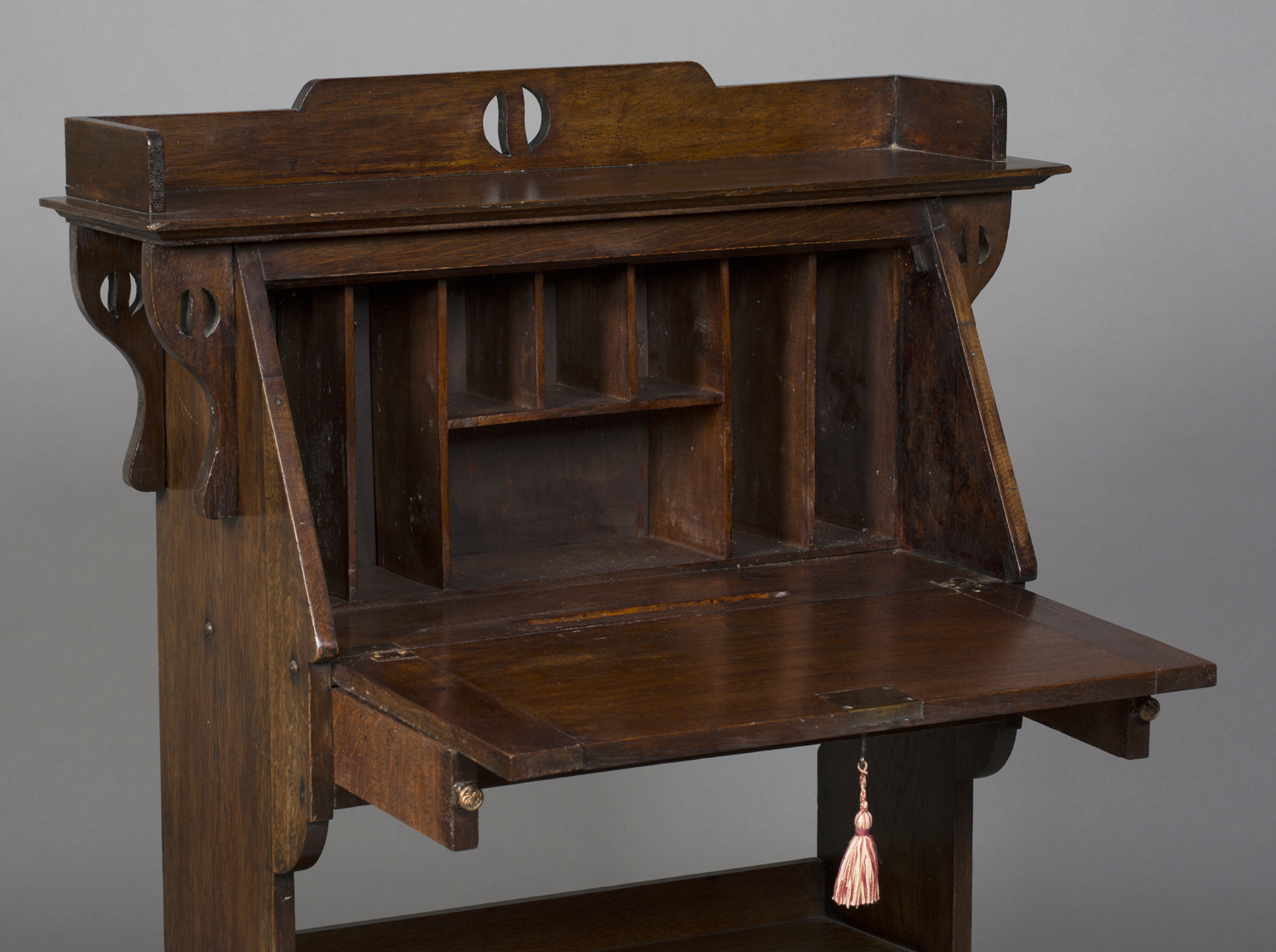 An Edwardian Arts and Crafts oak student's bureau, in the manner of Liberty & Co, the pierced - Image 2 of 2