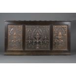 An Edwardian Arts and Crafts oak framed and pierced copper radiator cover panel, in the manner of