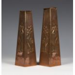 A graduated pair of Arts and Crafts Newlyn copper vases of tapering square section, each body worked