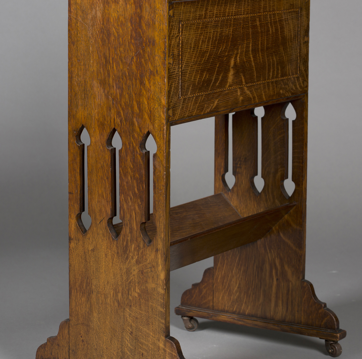 An Edwardian Arts and Crafts oak magazine/book rack, possibly Glasgow School, the shaped and pierced - Image 2 of 2