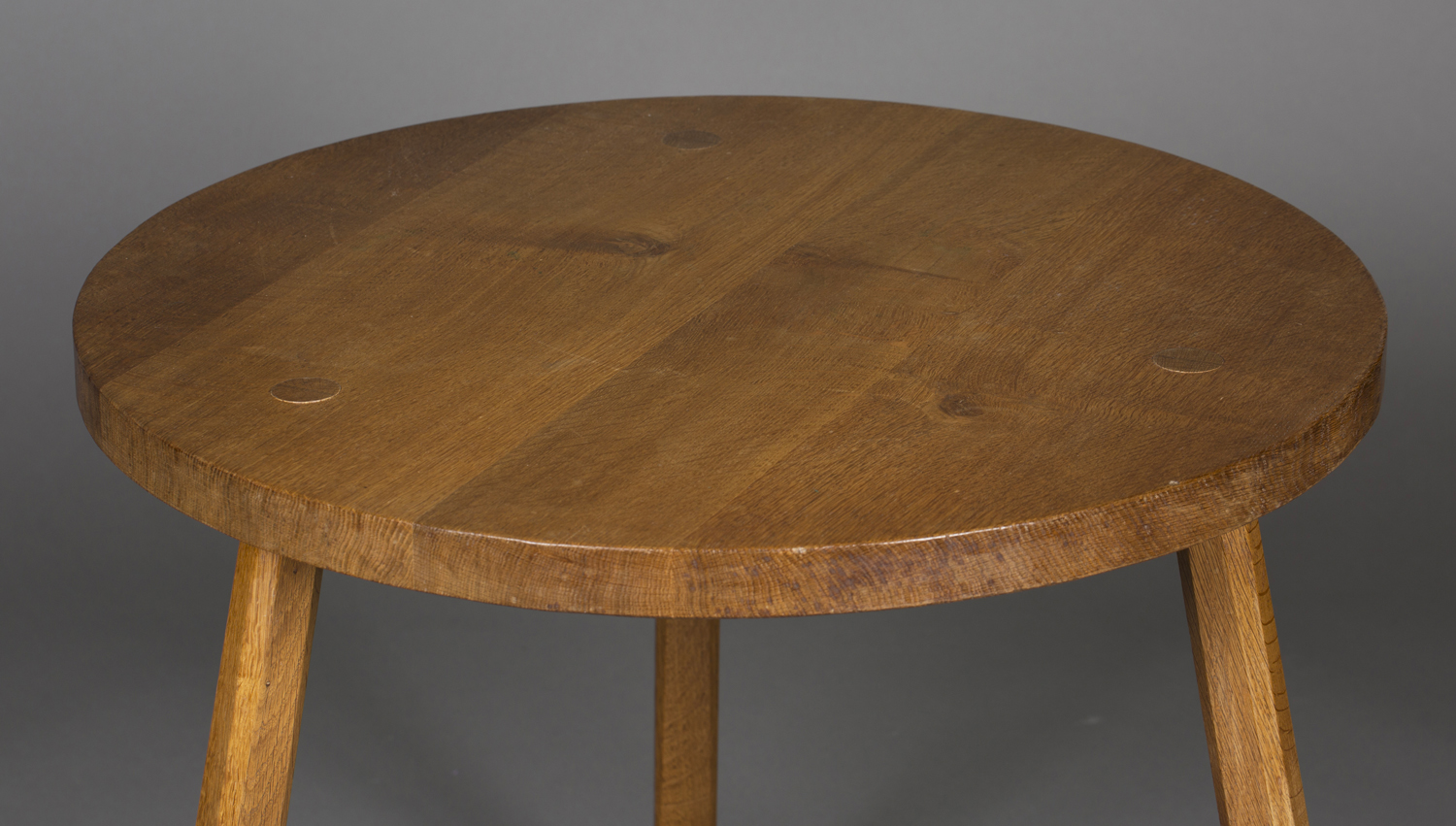 A Yorkshire School Arts and Crafts style oak circular supper table, in the manner of Robert ' - Image 2 of 2