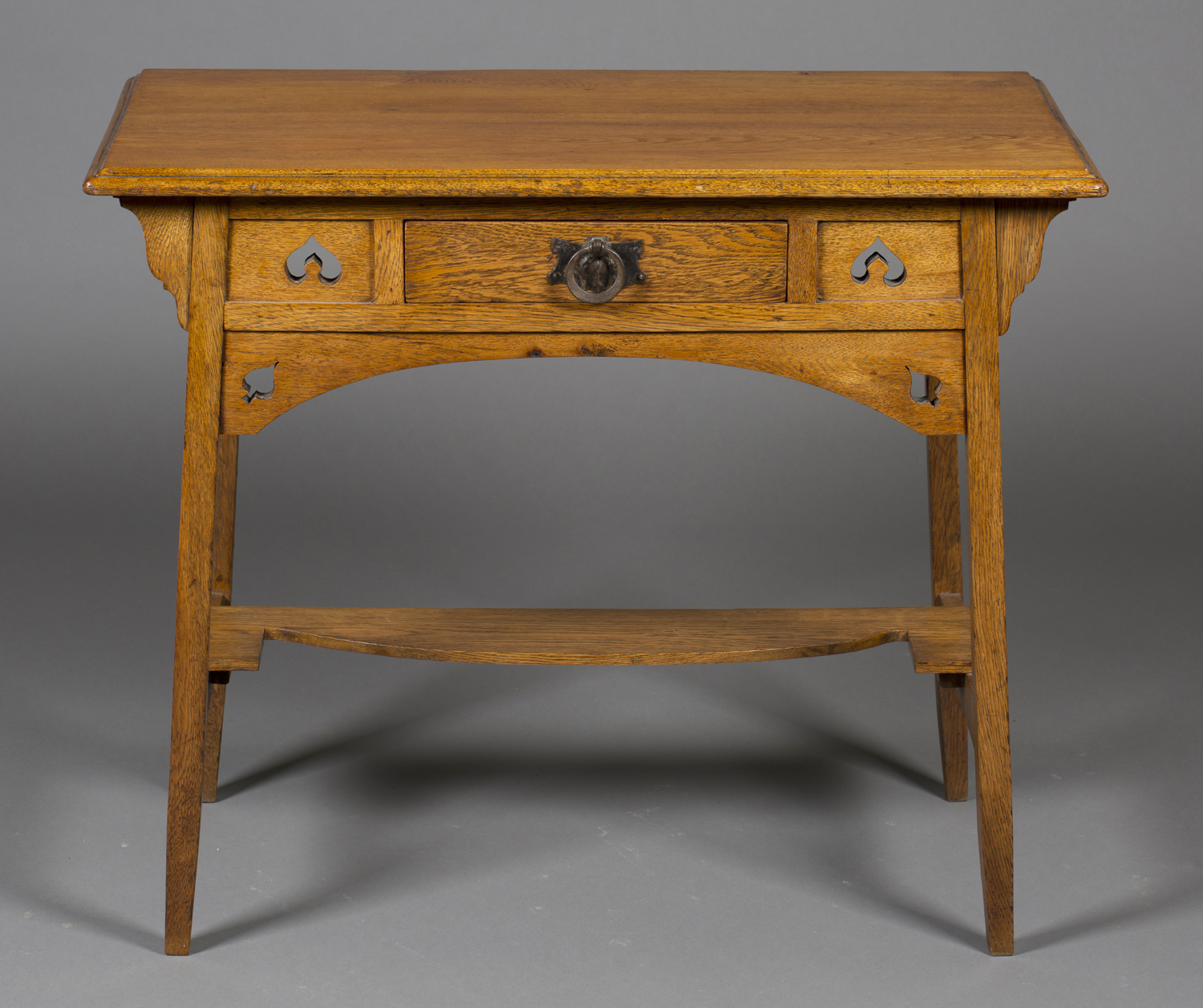 An early 20th century Arts and Crafts oak side table, in the manner of Liberty & Co, the frieze - Image 2 of 2