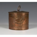 An Arts and Crafts Newlyn copper oval biscuit box and cover, the removable lid fitted with a loop