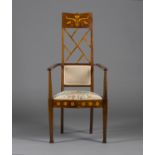 An Edwardian Arts and Crafts mahogany and foliate inlaid elbow chair, possibly by J.S. Henry, the