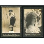An album containing approximately 533 Ogden's Guinea Gold photographic cigarette cards, including