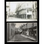 A collection of 18 postcards of Devon, including a photographic postcard of Prout's Garage