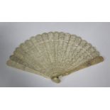 A Chinese Canton export ivory brisé fan, mid-19th century, the guards carved in relief with