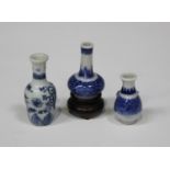 A group of three Chinese blue and white porcelain toy vases, Qing dynasty, comprising a bottle vase,