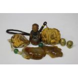 Two Chinese agate pendants, late Qing dynasty, each carved and pierced in the form of fruit and