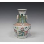 A Chinese famille rose porcelain vase, late Qing dynasty, the shouldered body enamelled with a