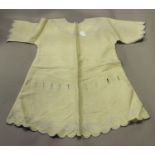 A collection of mainly Victorian and Edwardian linen clothing, including day dresses, nightgowns,