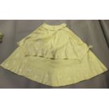 A Victorian cream fabric baby's tiered cape, embroidered in ivory silk with trailing foliage and