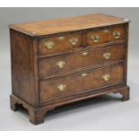 A 20th century George III style burr elm chest of two short and two long drawers, on bracket feet,