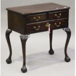 A mid-18th century mahogany lowboy, the moulded top above three drawers, raised on carved cabriole