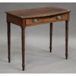 A George III mahogany bowfront side table, fitted with a single frieze drawer, on turned legs,