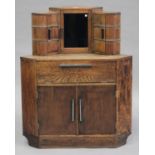 An Art Deco oak corner drinks cabinet with chromium plated mounts, on a plinth base, height 114cm,