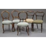 A pair of Victorian rosewood spoon back dining chairs, on turned legs, together with a pair of