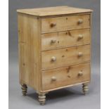 An early 20th century pine chest of four drawers, on turned feet, height 105cm, width 74cm, depth