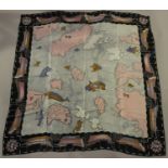 A collection of ten printed silk scarves, including a Josef Otten scarf, printed with a map and