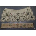 An early 18th century ivory silk apron of lobed outline, embroidered in metal thread and coloured